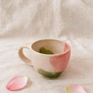 Porcelain mug in white, pink, and green